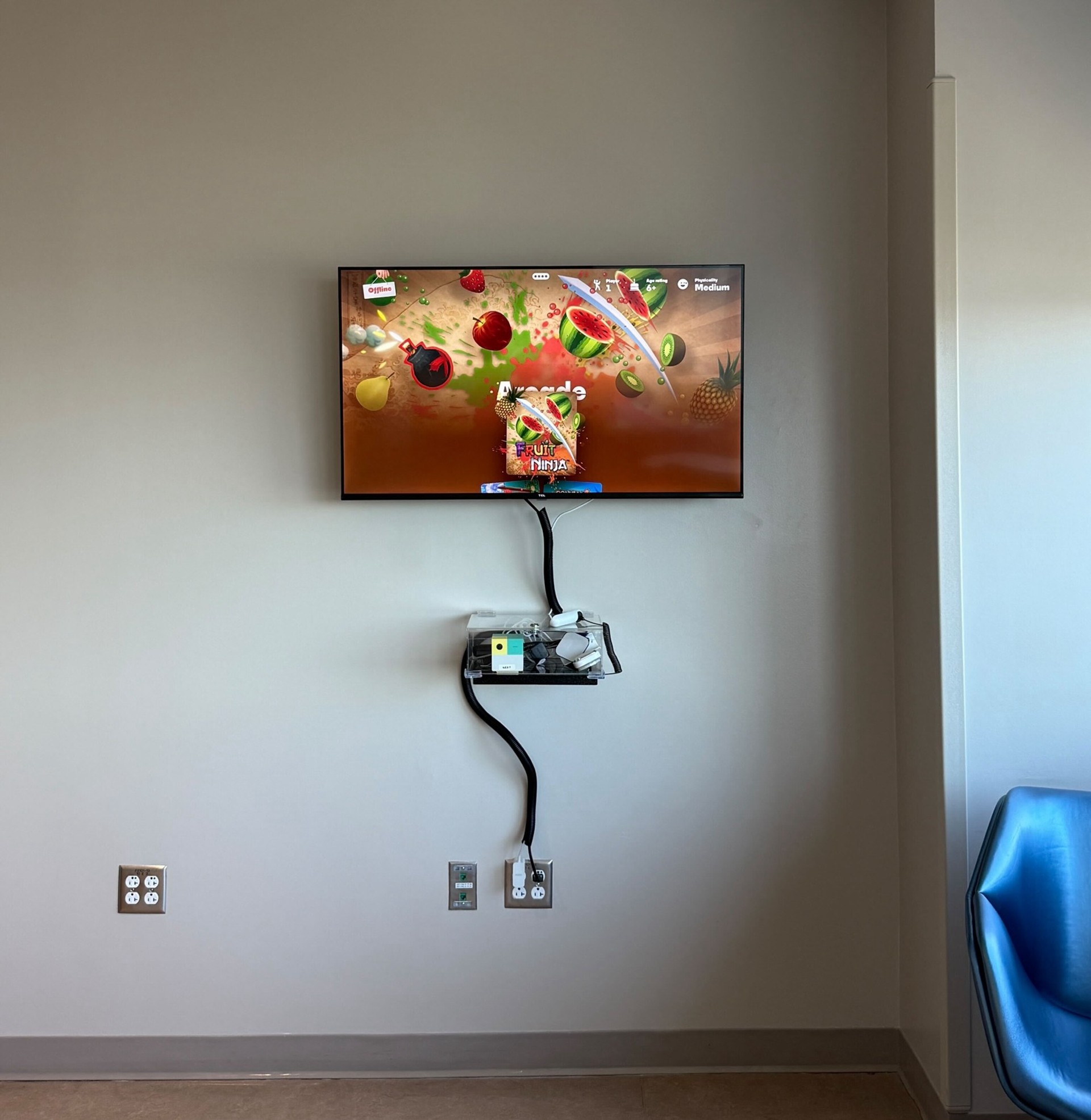 Fruit Ninja being played on Nex Playground in a hospital room