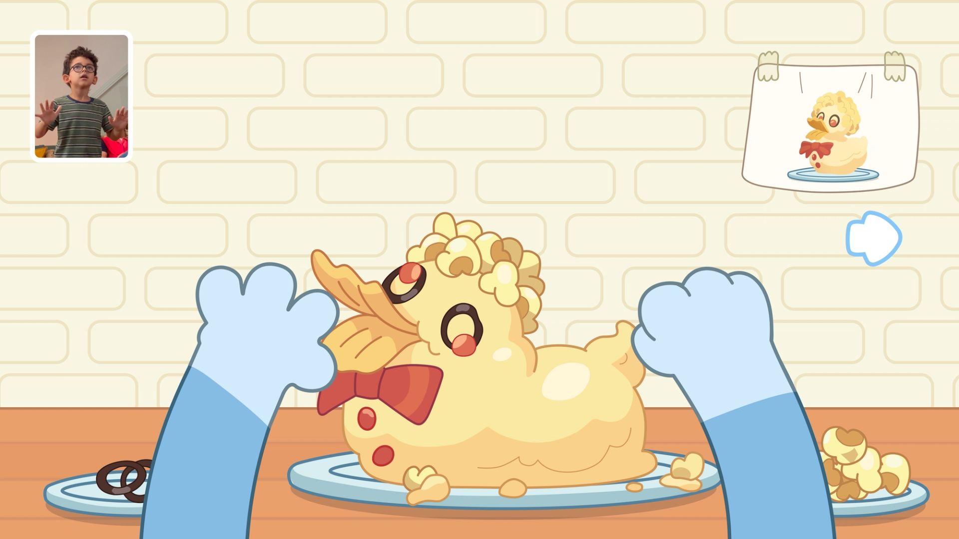 Image of boy creating his own virtual Duck Cake in the new Bluey video game, Bluey: Bust-a-Move, only on Nex Playground with Play Pass.