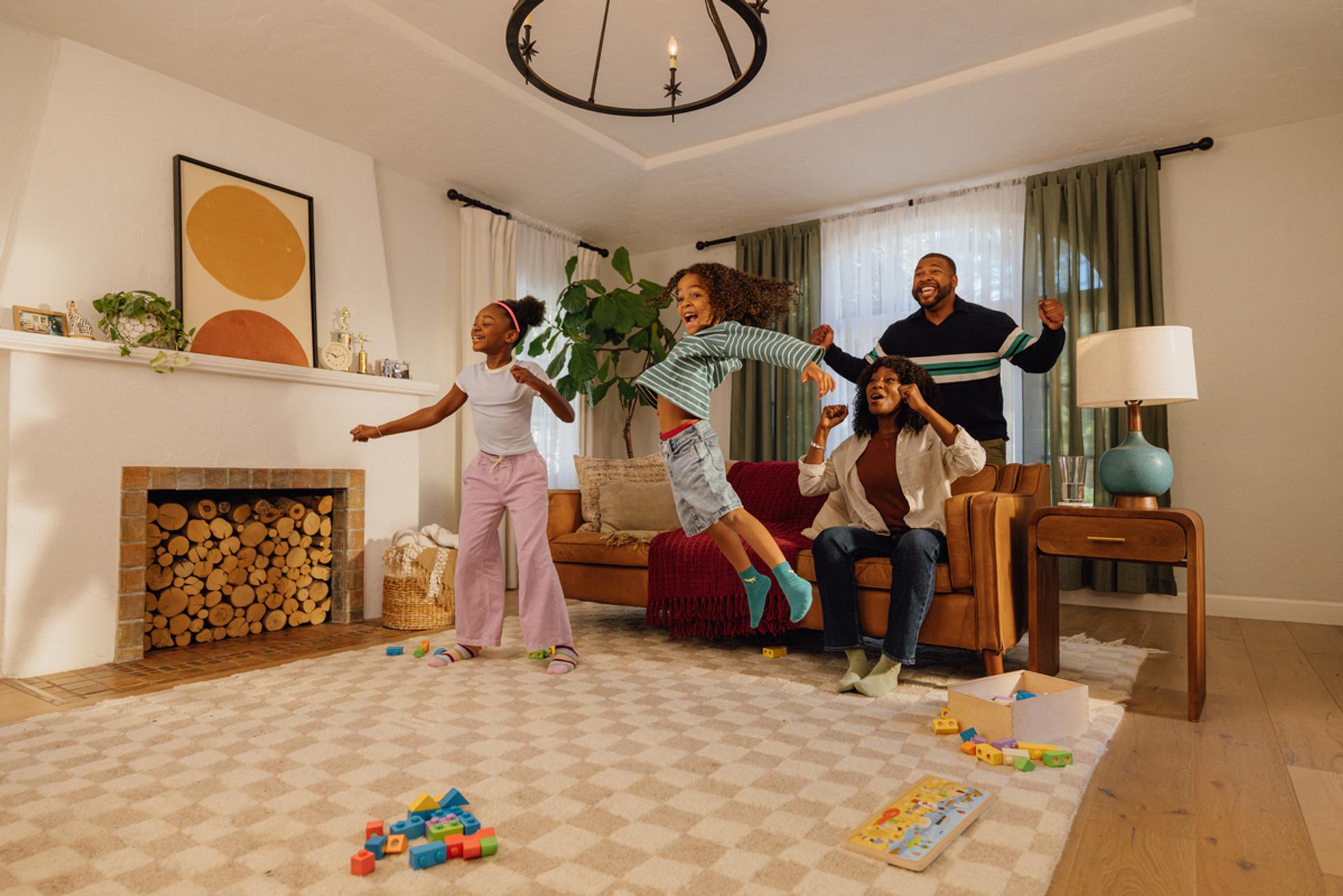 A family getting fit together in their living room with Nex Playground.