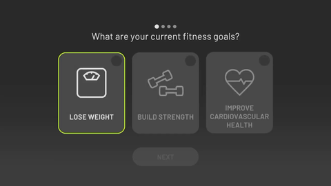 Fitness goal selection screen on NexGym for Nex Playground, displaying a menu that prompts users to choose between losing weight, building strength, or improving cardiovascular health.