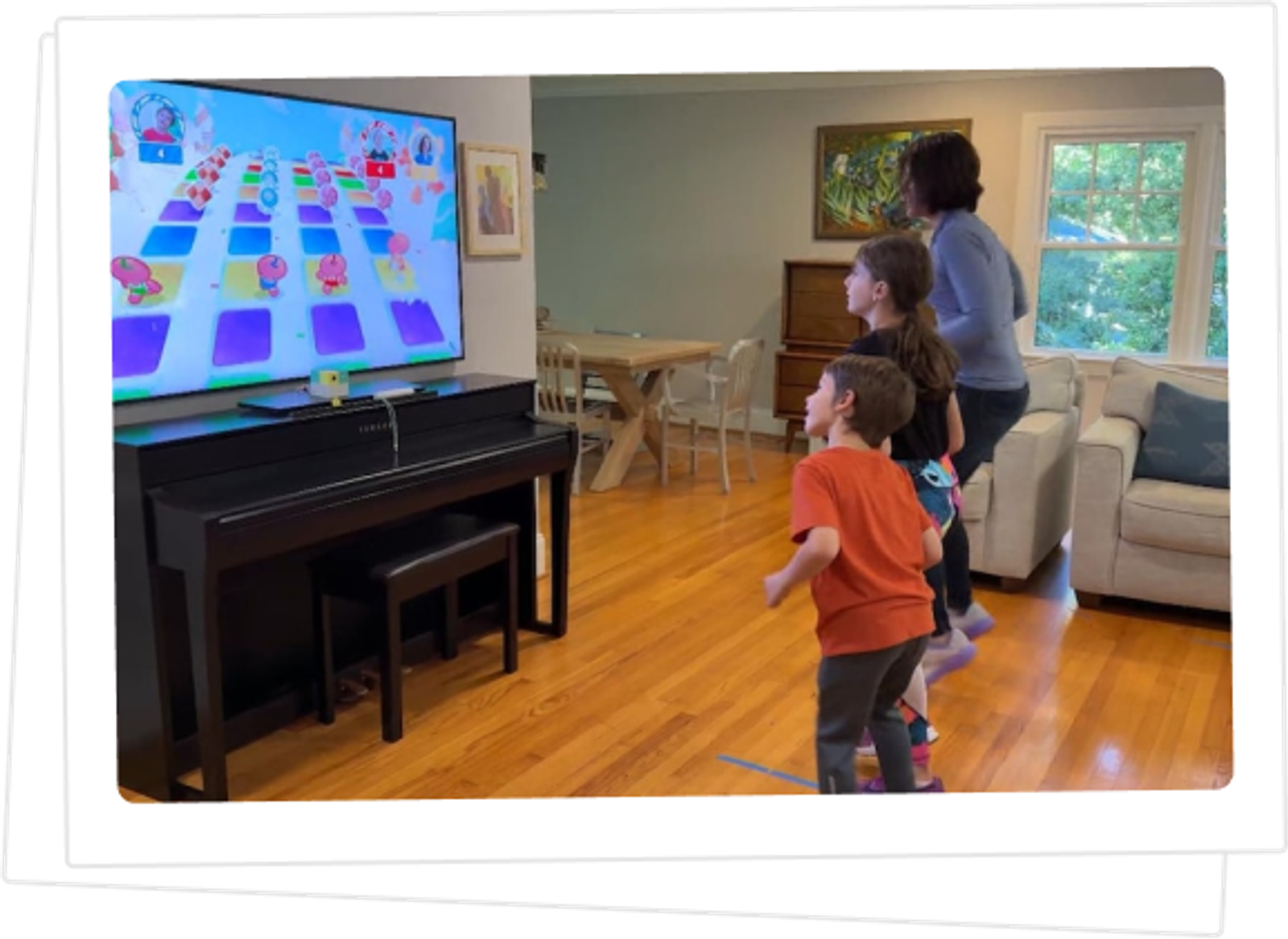 A family playing Nex Playground together in their living room.