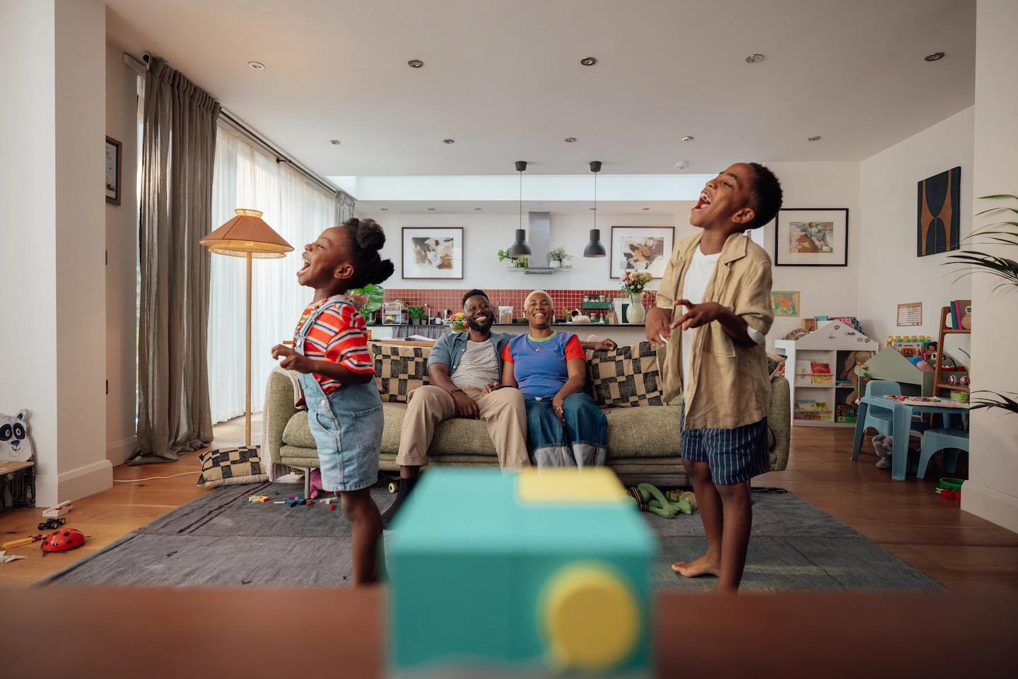 family in living room playing