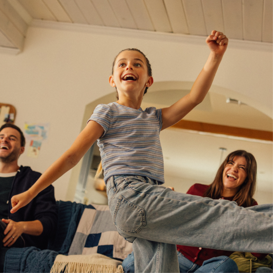 Girl moving her body in a living room.