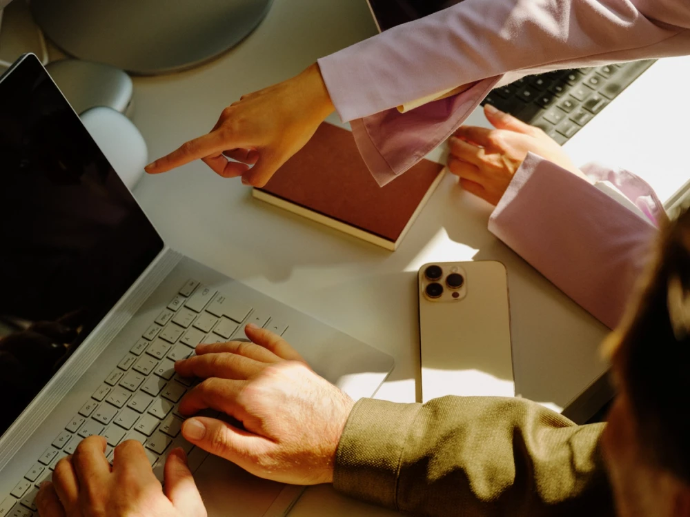 Two people working on a computer