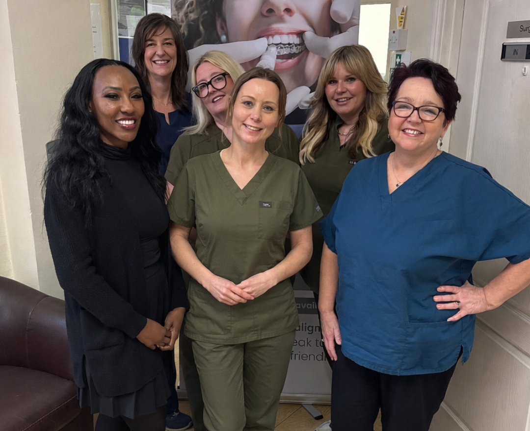 The Beacon Park team standing together in the practice and smiling