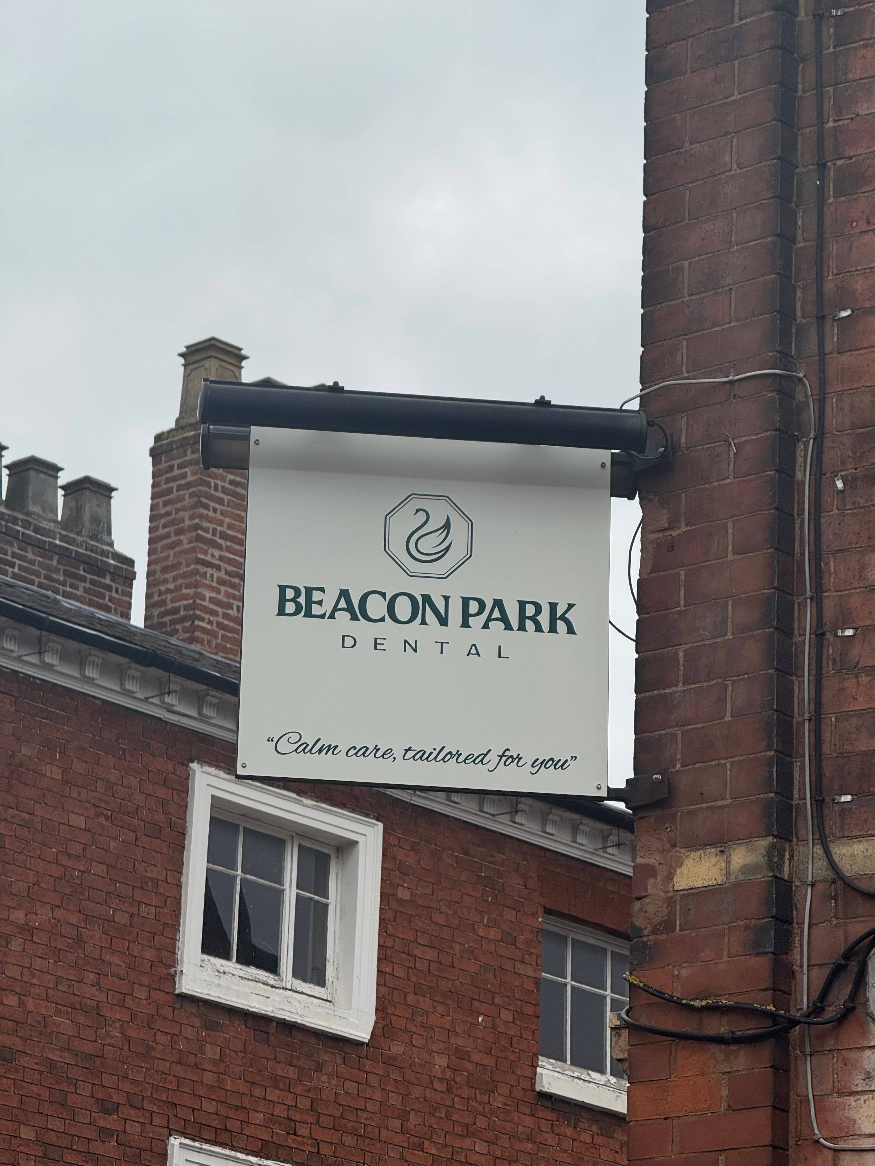 The Beacon Park Dental sign that hangs outside our clinic