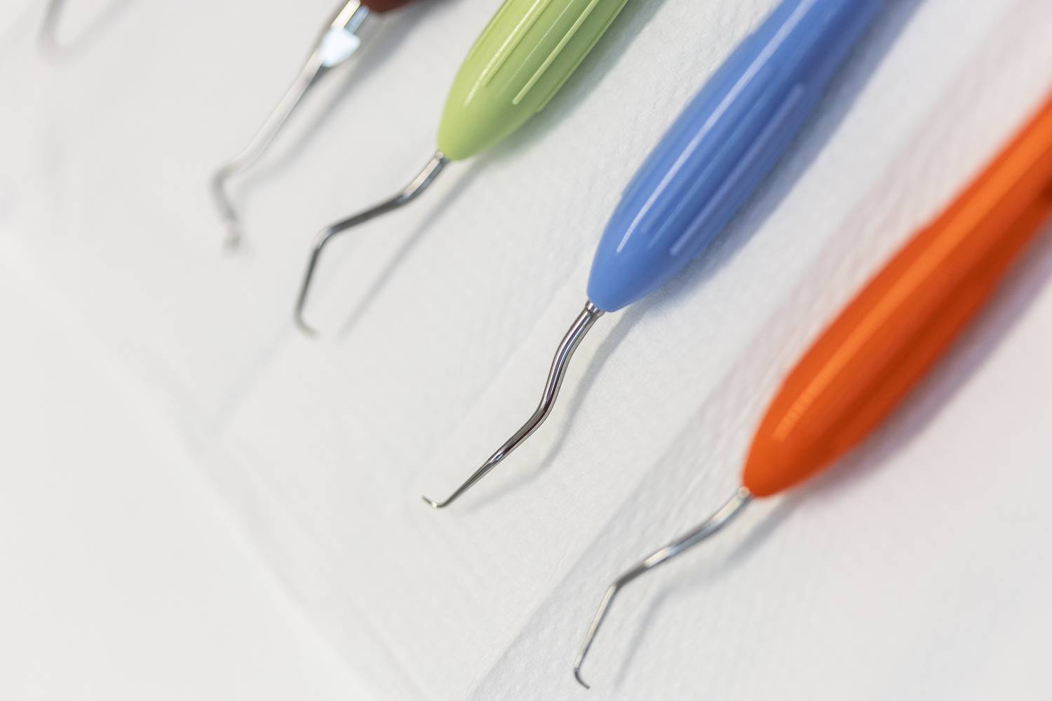 A close up of some colourful dental instruments
