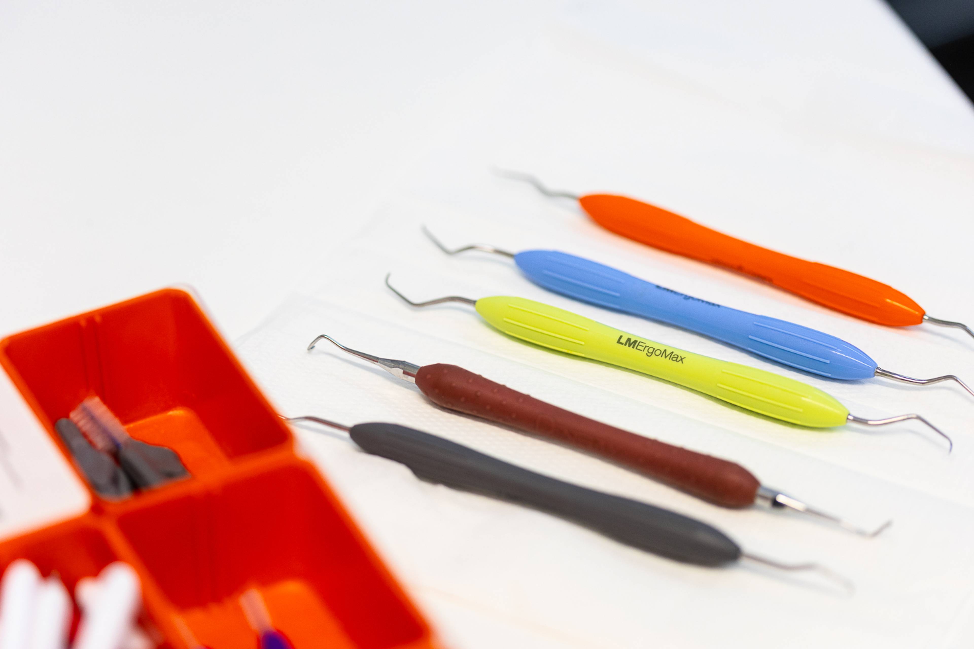 A selection of dental equipment laid on a treatment table ready to be used in a dental examination