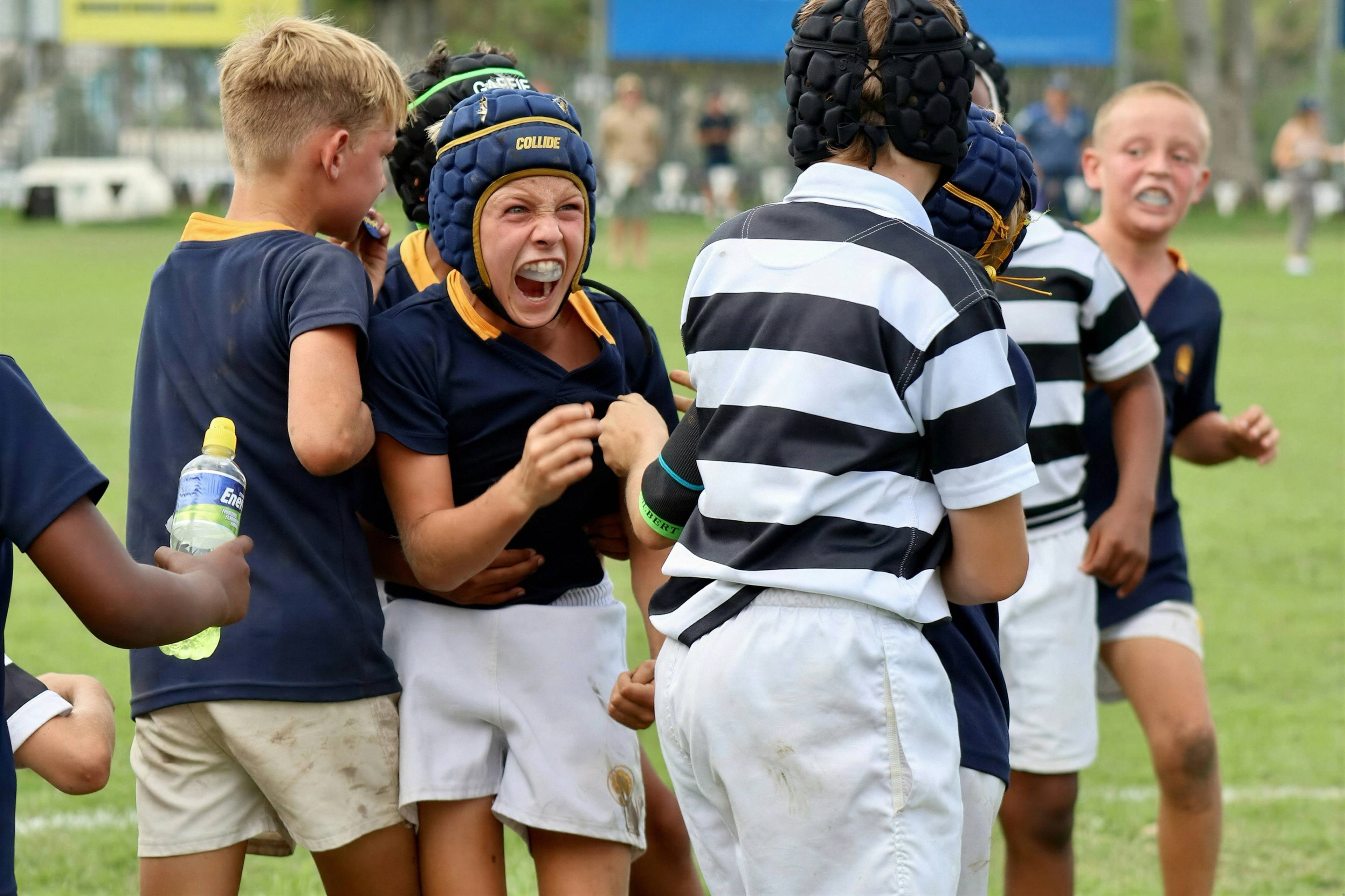 A stock photo of children playing sports and wearing gumshields