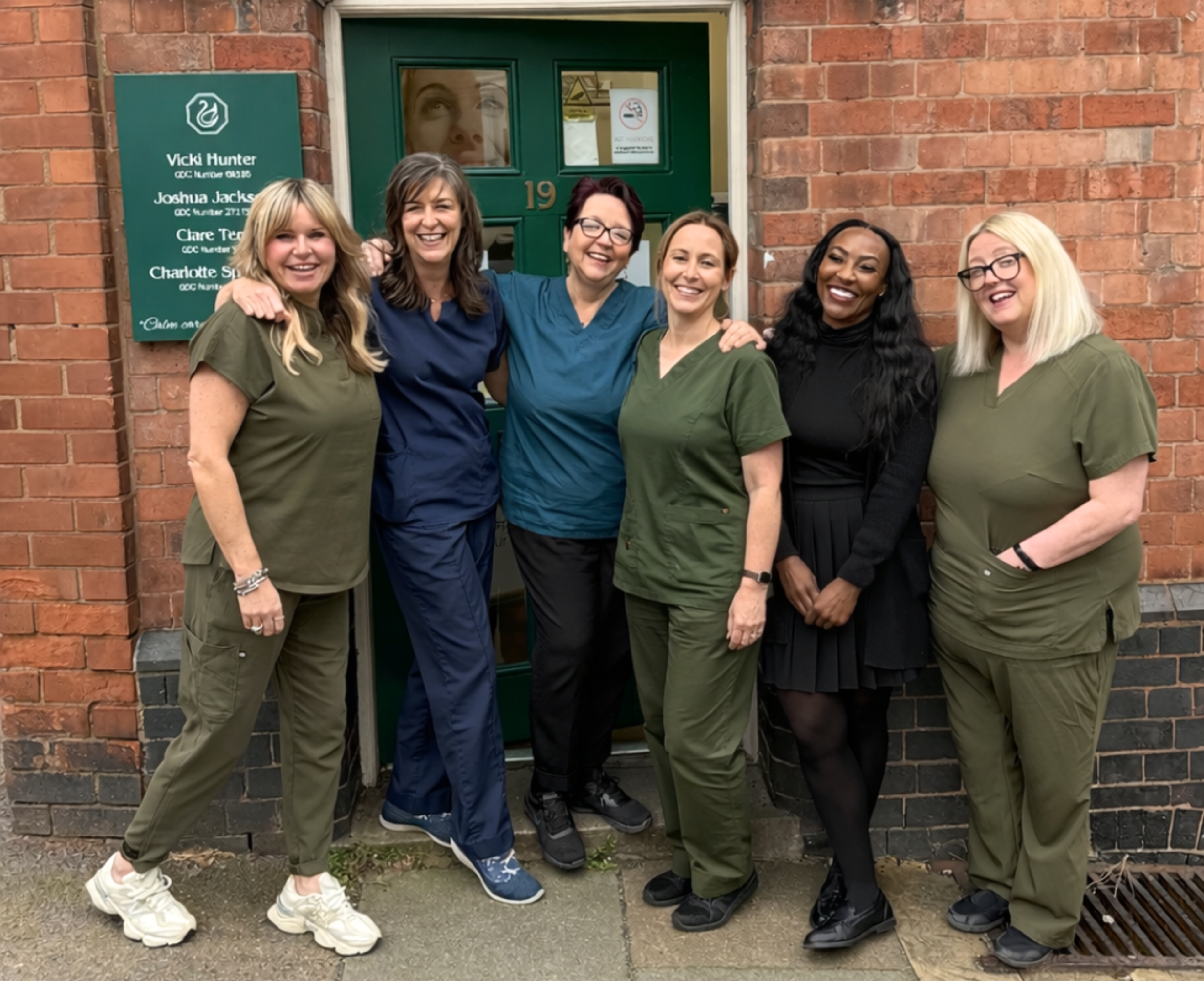 Vicki Hunter stands with the rest of the Beacon Park team outside the entrance of the practice