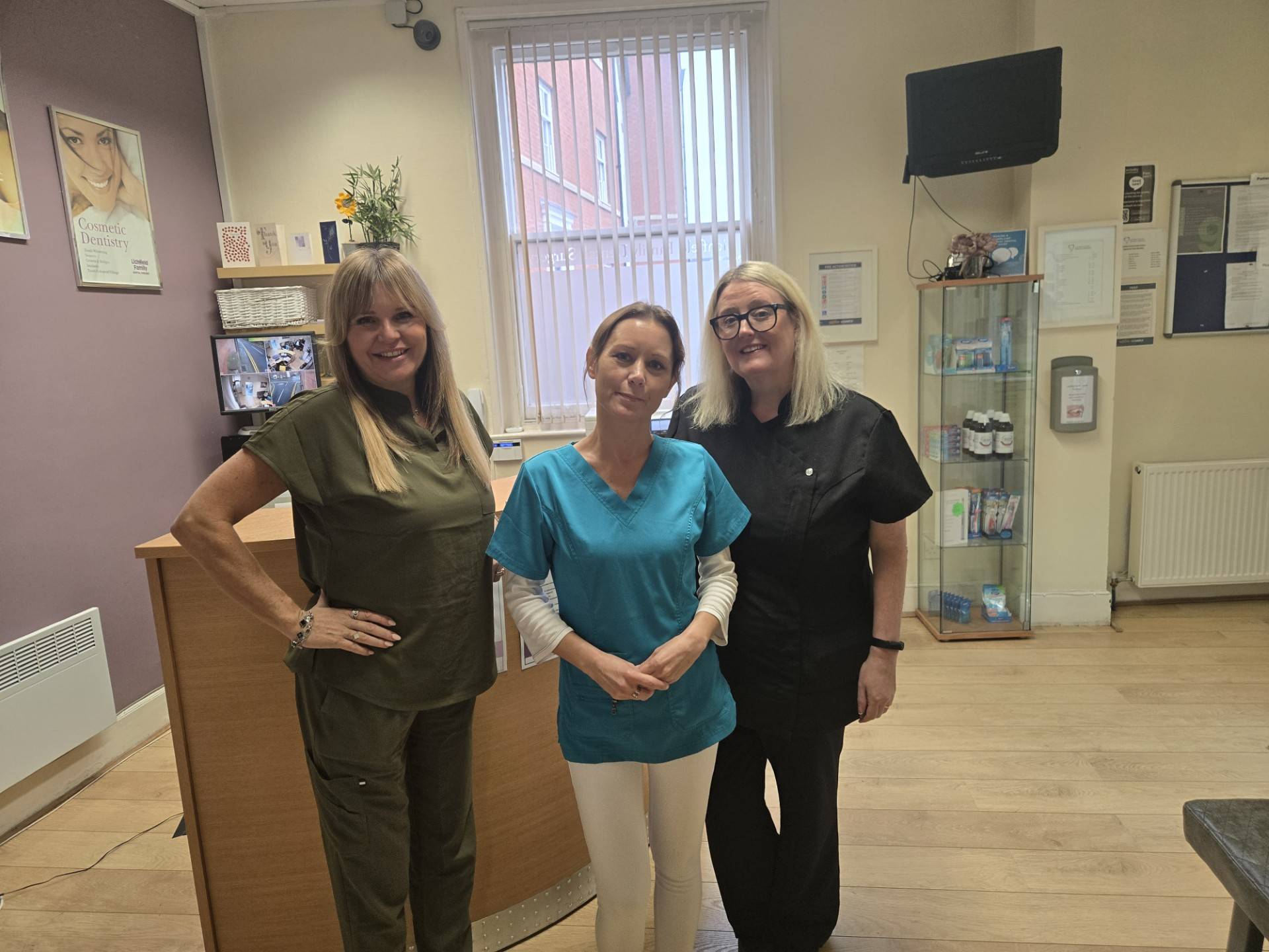 Dentist explain membership plan to patient sat in chair