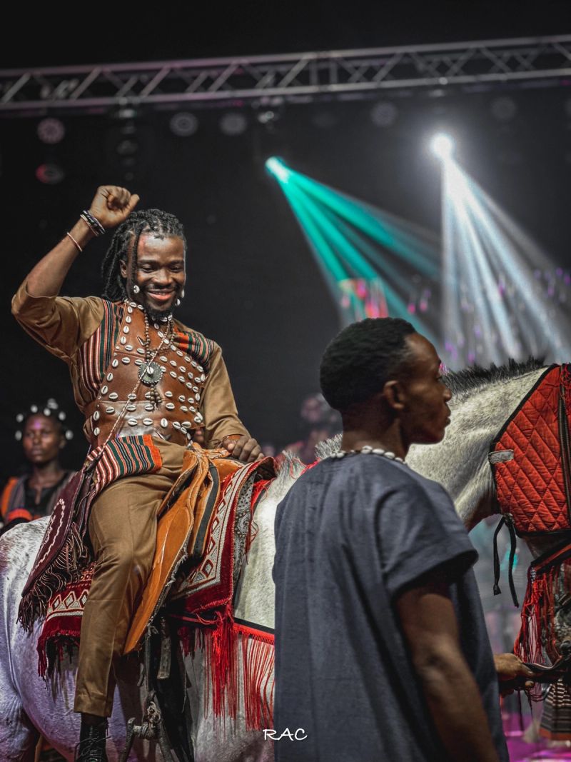 The Abuletic King rides onto the Grand Finale stage on horseback