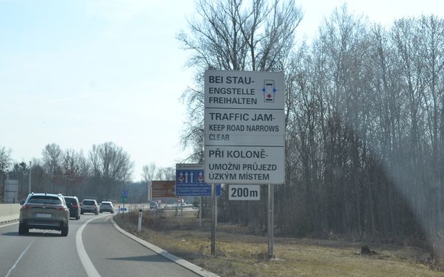 Traffic jam ahead, road narrows 200m