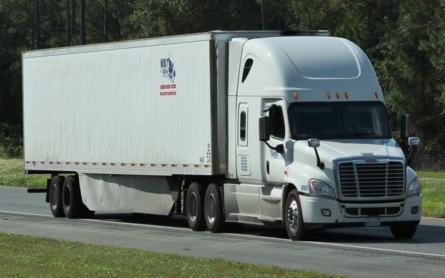 Commercial semi truck with trailer traveling on an Ohio highway