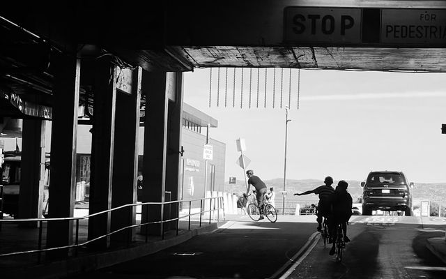 Cyclist riding on a road alongside traffic