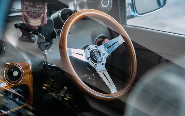 a steering wheel and dashboard of a car