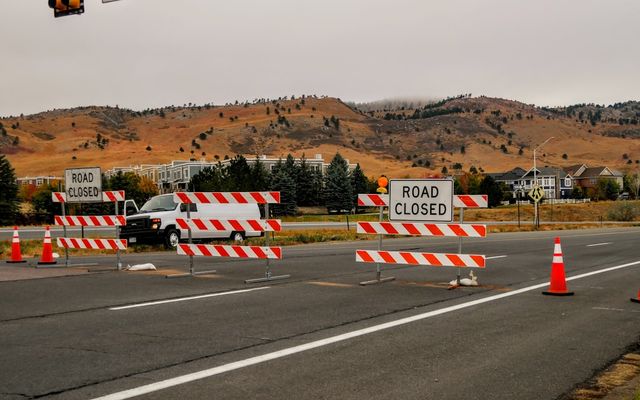 red and white flag on road during daytime