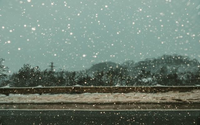 Cars driving on a snowy winter road