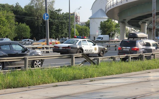 A bunch of cars that are sitting in the street