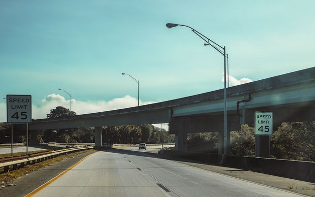 Speed limit sign on a highway