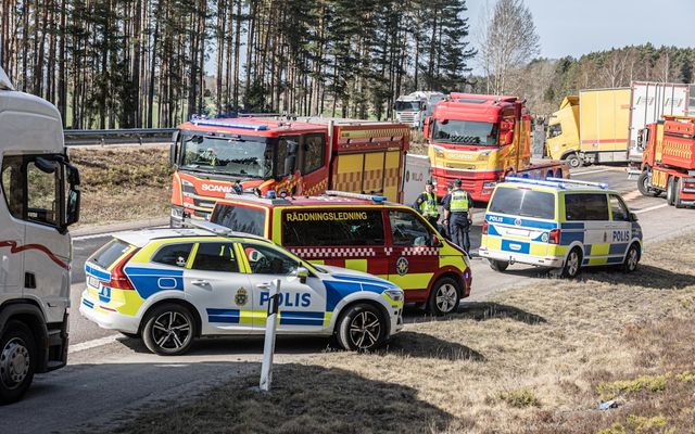 Emergency vehicles responding to a traffic incident on the road.