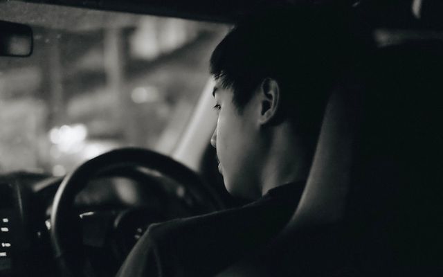 Young driver behind the wheel of a car