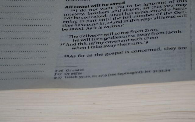 A close up of a book with a page in it