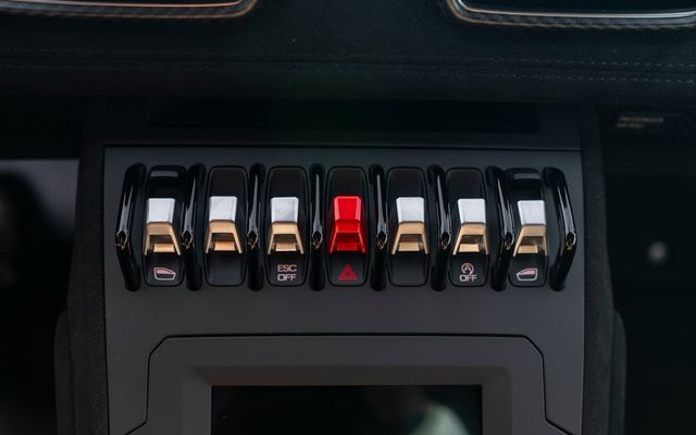 Car interior controls and switches are shown.