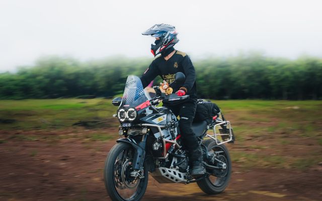 Motorcyclist riding on an open road