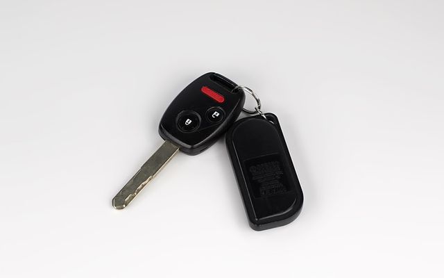a car key with a remote control attached to it