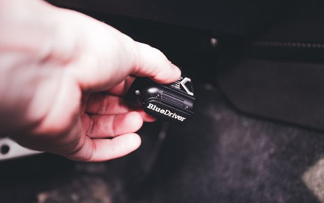 a person holding a camera in their hand