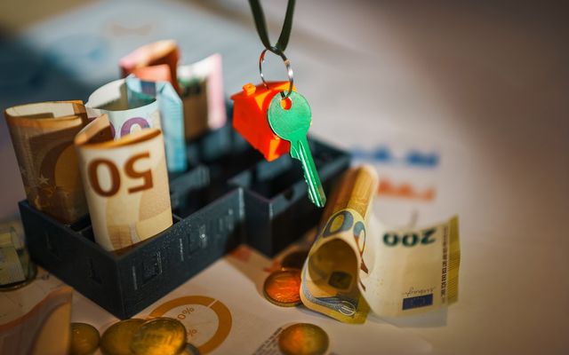 A bunch of money sitting on top of a table