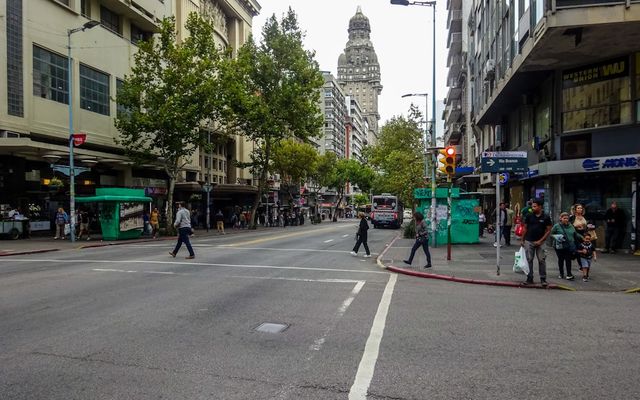 People crossing a street in a city