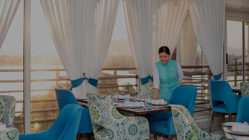 IHCL team member preparing the restaurant space