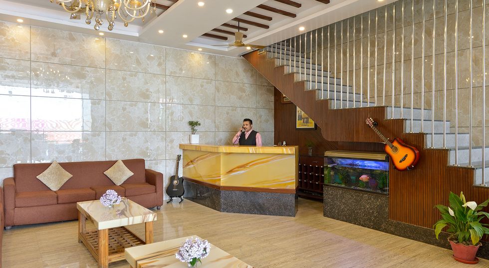 Modern reception desk and lobby seating area at Ginger Lansdowne hotel.