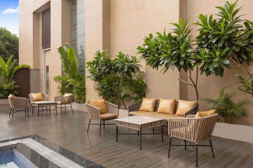 Poolside seating area at Ginger Etawah, Gwalior Bypass Road