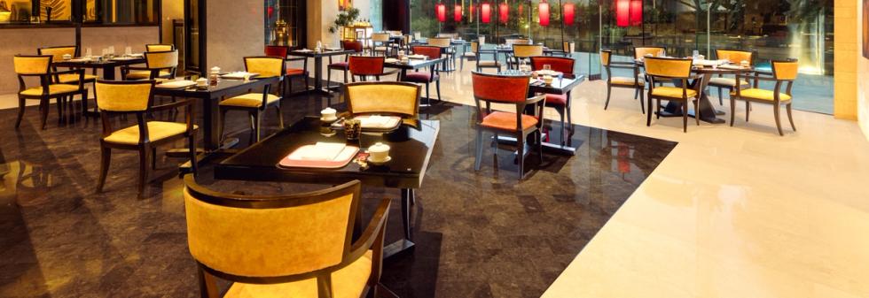 Fine dining space featuring polished floors and comfortable seating.