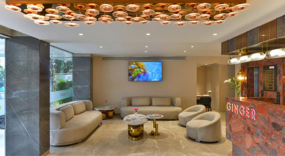 Modern hotel lobby and seating area at Ginger Indore, Nipania.