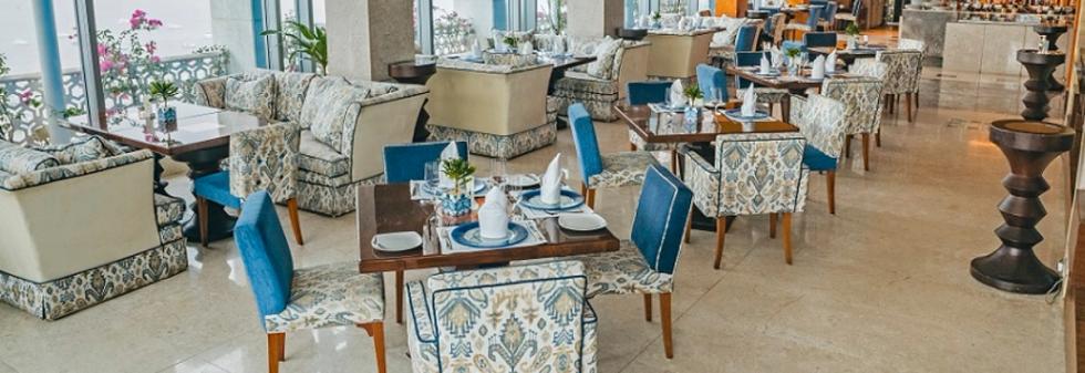 Modern fine-dining restaurant with comfortable seating and bright natural light