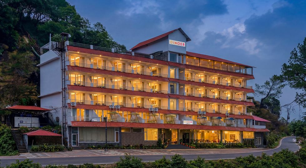 Illuminated evening exterior of Ginger, one of the top hotels in Lansdowne near Mall Road.