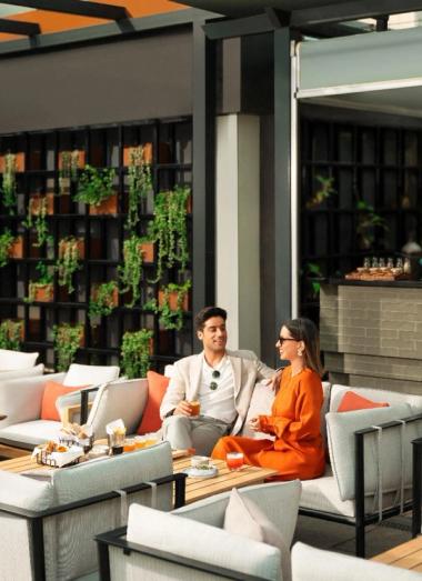 Guest enjoying drinks and snacks at a luxury restaurant