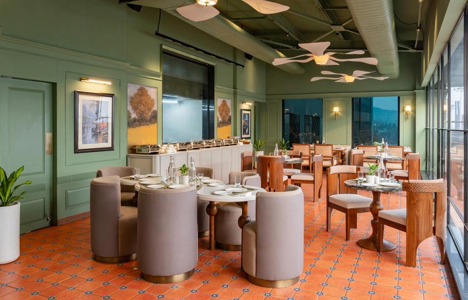 Qmin restaurant dining area with elegant seating and buffet counter at Ginger Mohali, Kharar Kurali Highway.