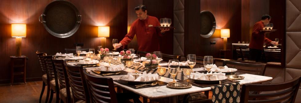 Fine dining restaurant with floral centerpieces and glassware