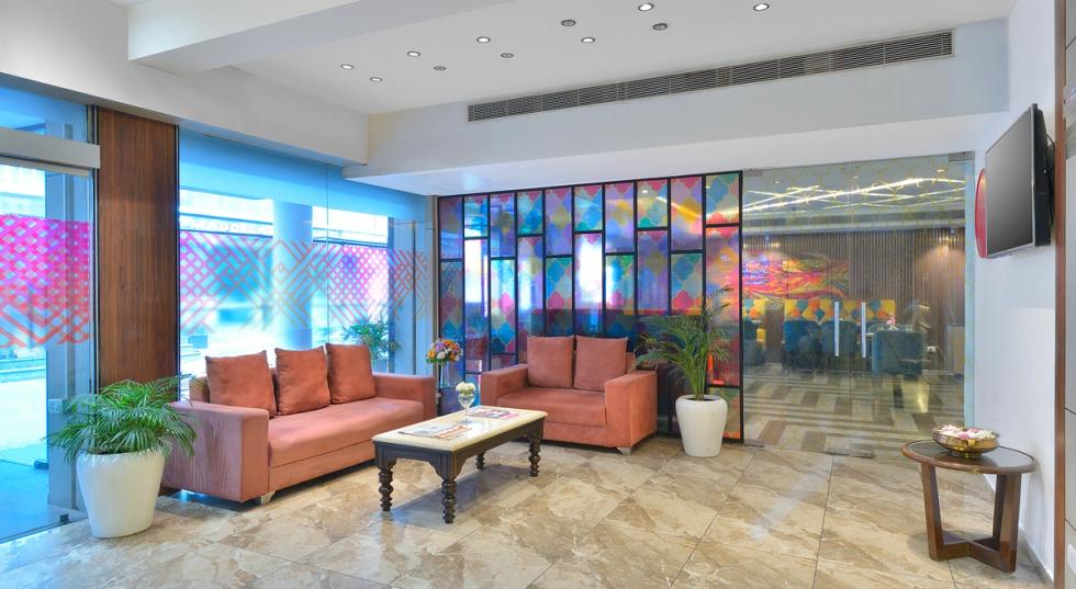 Modern lounge seating area in the lobby of Ginger Jammu, Bari Brahmana.