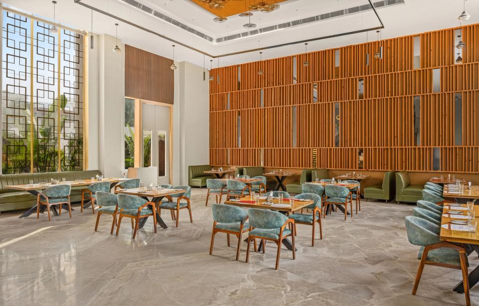 Dining area at Qmin restaurant in Etawah, Saraiya Village