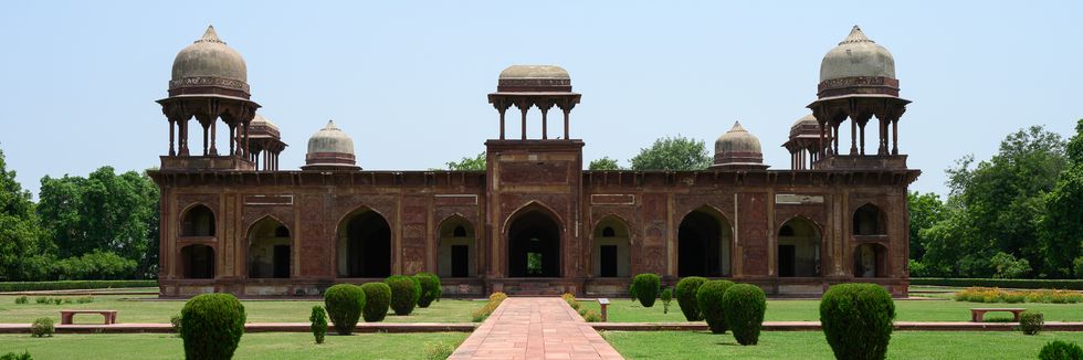 Historic Mughal monument surrounded by lush gardens in Agra.