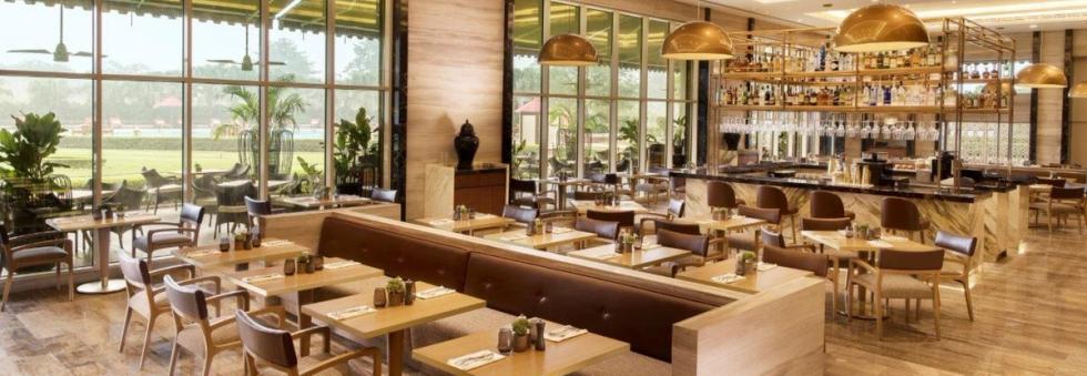 European-inspired restaurant interior with blonde wood and clean lines