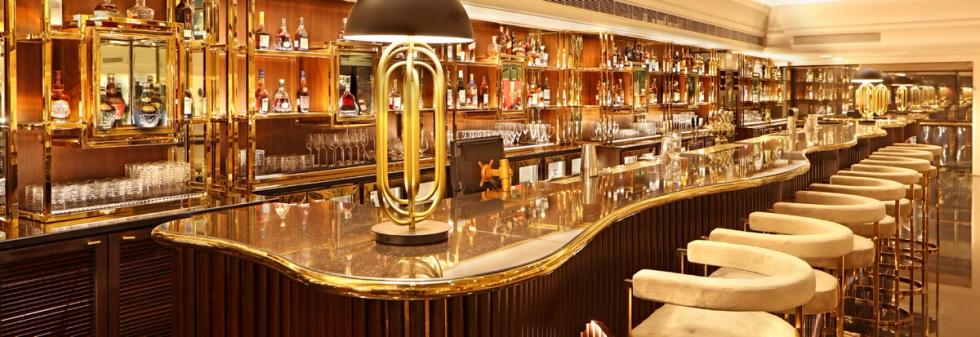 Modern bar interior with marble countertop and comfortable seating