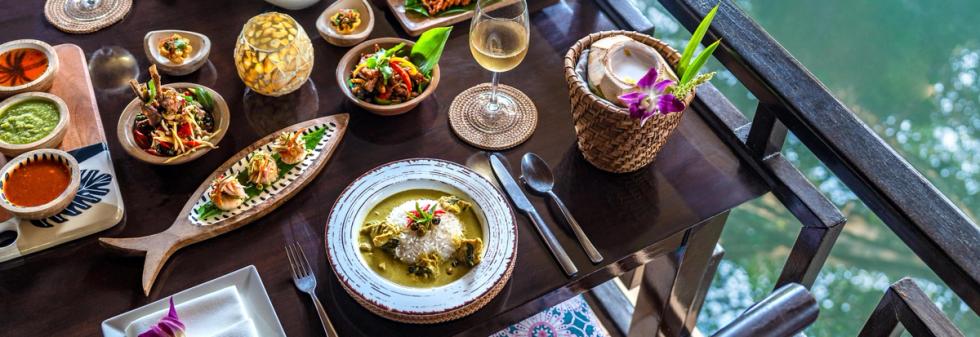 Waterfront dining experience with dishes, sauces, and views