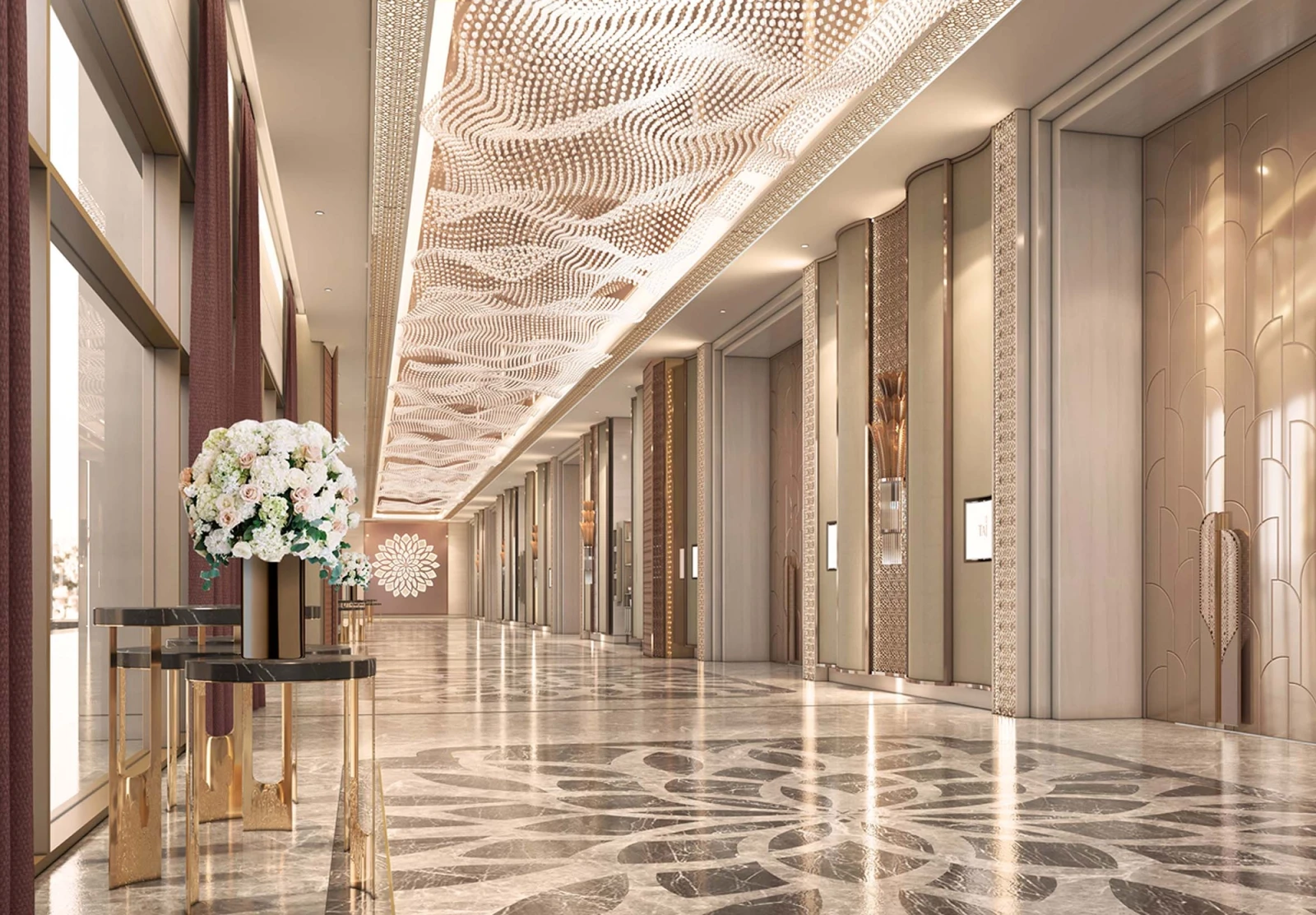 Bright Taj Amer interior with tall windows, patterned marble floors and a long architectural perspective.